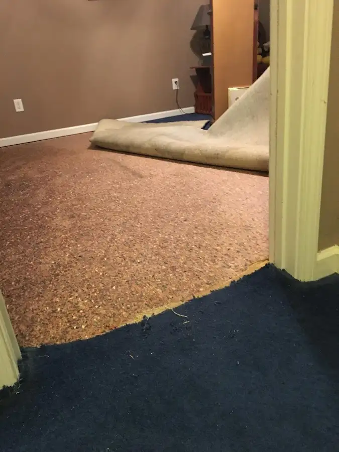 Carpet pad removal revealing water damage during Water Mitigation Services in Incline Village